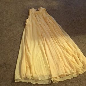 a yellow flowing dress.